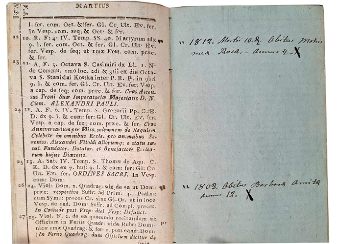 An open old book showing printed Latin text on the left page and handwritten notes with dates on the right page.
Description generated by AI